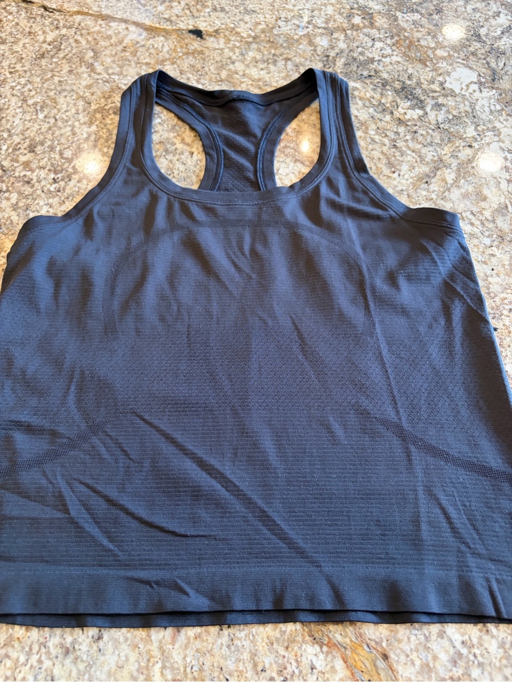 lululemon athletica Black Racerback Tank Top
Swiftly waist length worn once